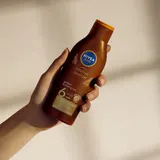 NIVEA SUN Karotin Sonnenlotion SPF 6 200 ml Bräunung & Feuchtigkeit – Bild 6
