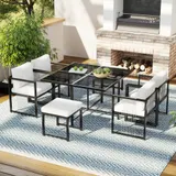 7-teiliges Garten-Essset für 6 Personen, Tisch aus gehärtetem Glas, 4 geflochtene Sessel und 2 Fußhocker, Schwarz+Weiß – Bild 3